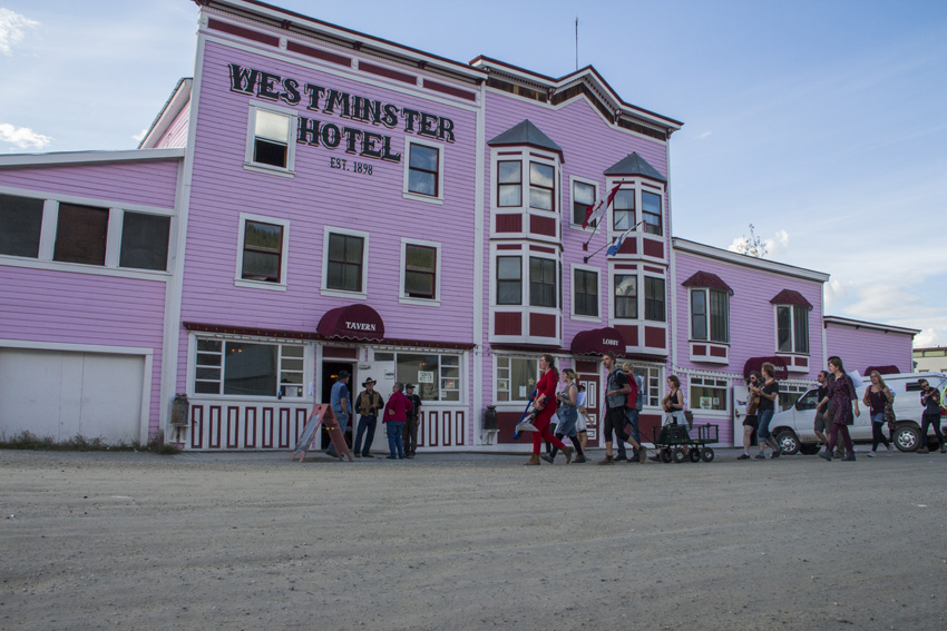 Band marching past Westiminster Hotel in Dawson City