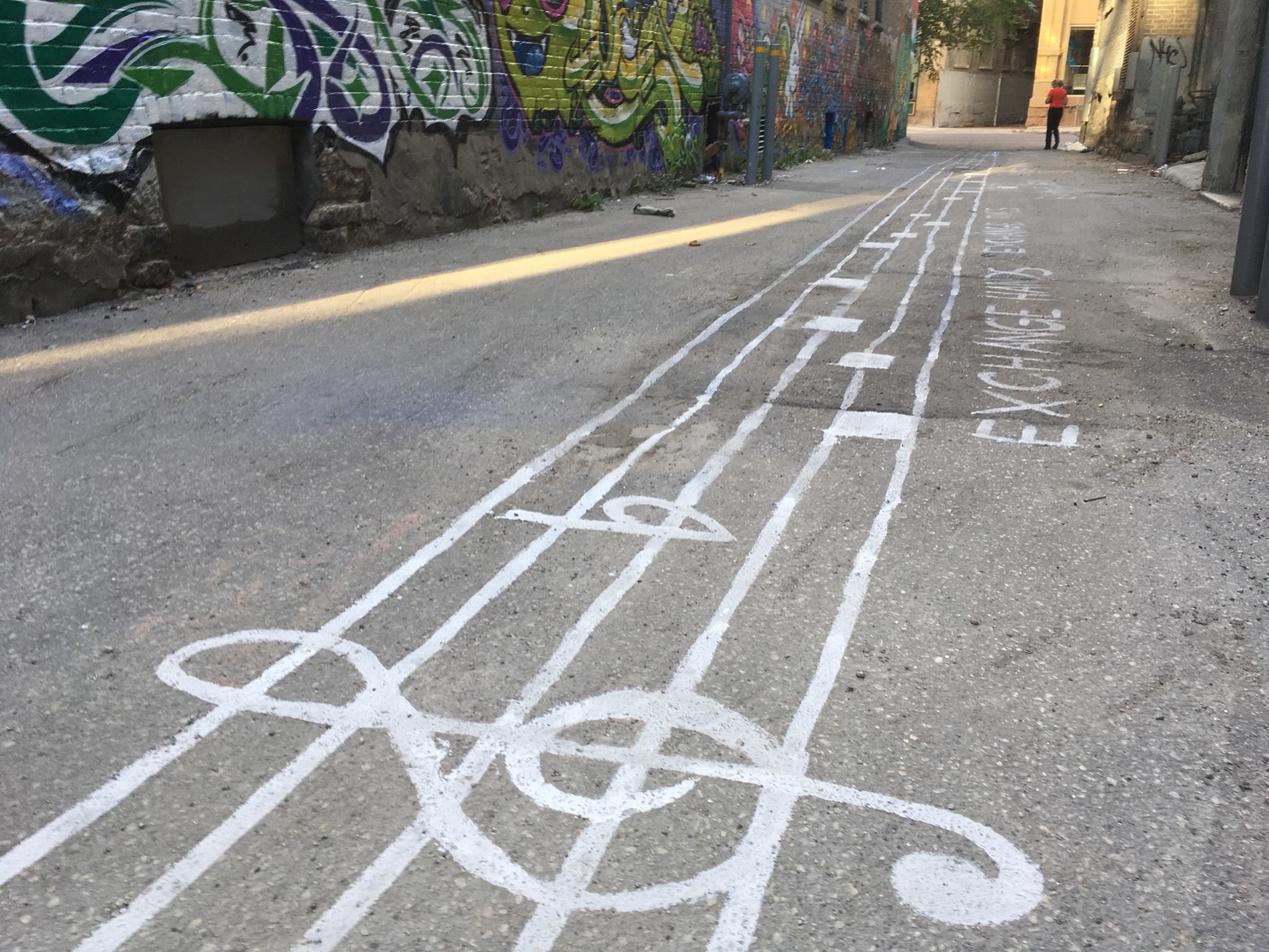 Image of Sounding the exchange painted on the alley ways of Winnipeg's exchange district